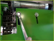 Loosen gearbox bolts